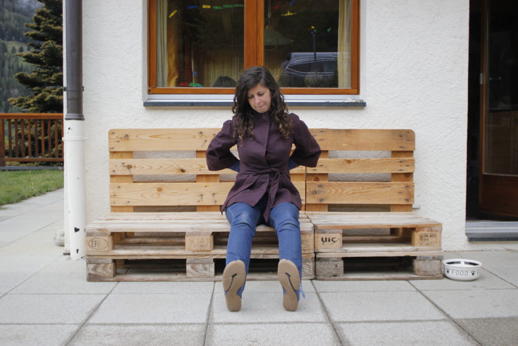woman sitting looking at wildlings shoe sole