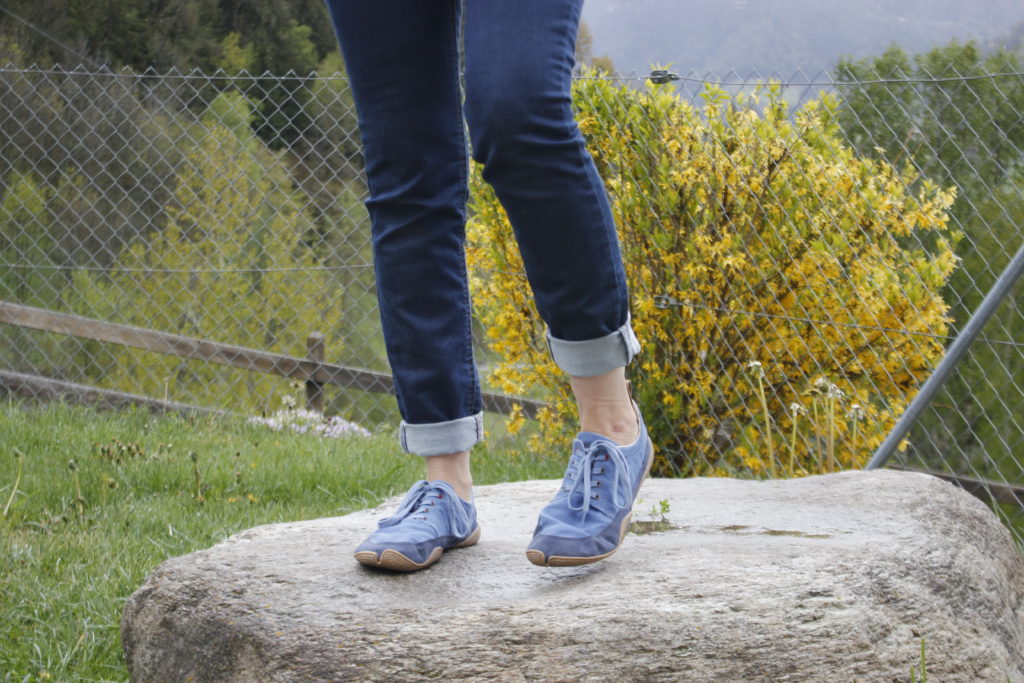 woman standing on rock wearing wildlings